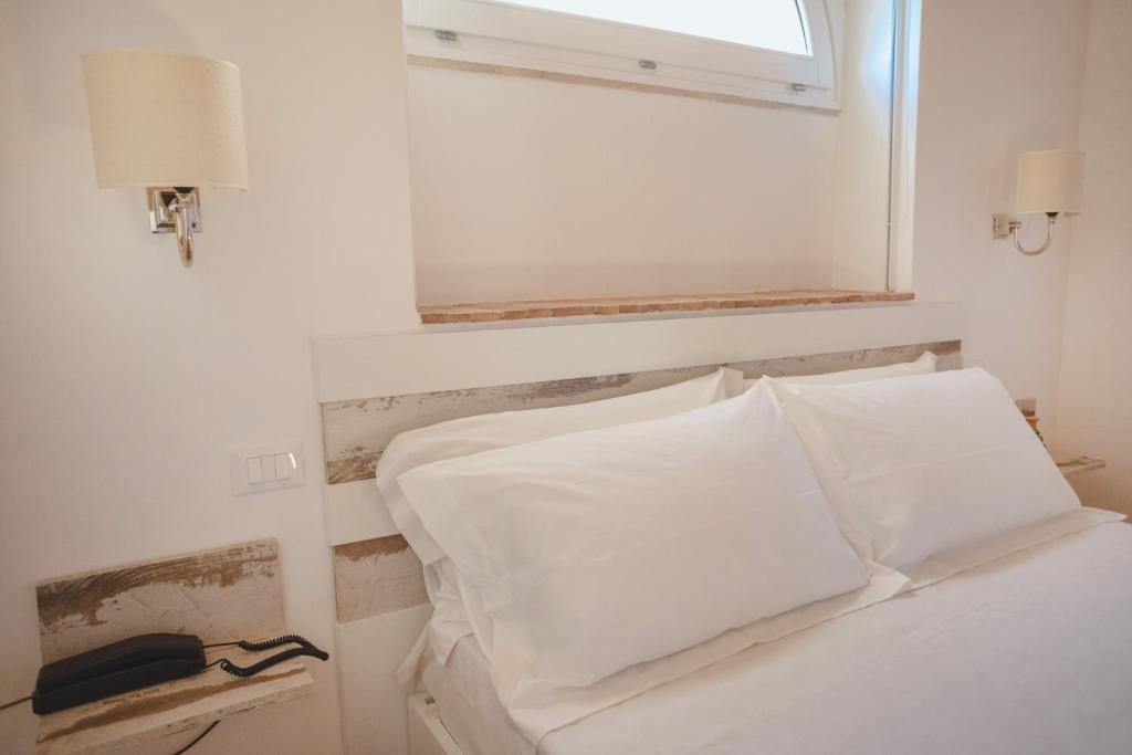 Postel nebo postele na pokoji v ubytování Masseria Testaferrata