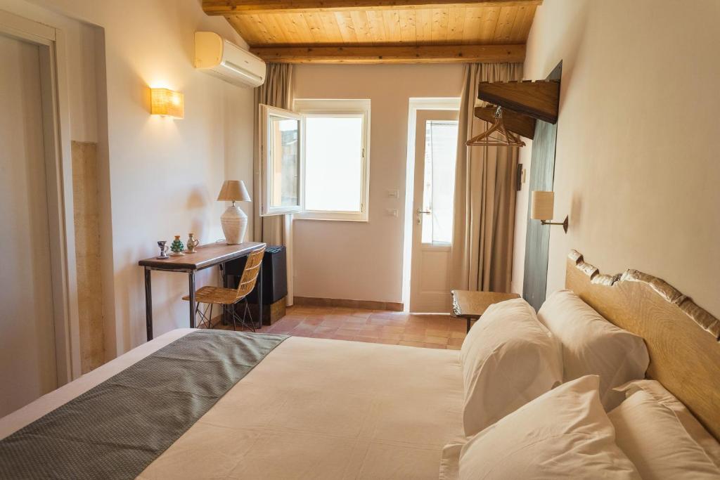 Postel nebo postele na pokoji v ubytování Masseria Testaferrata