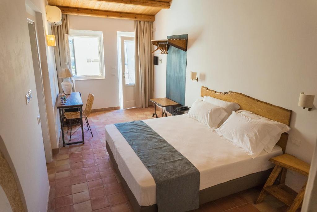 Postel nebo postele na pokoji v ubytování Masseria Testaferrata