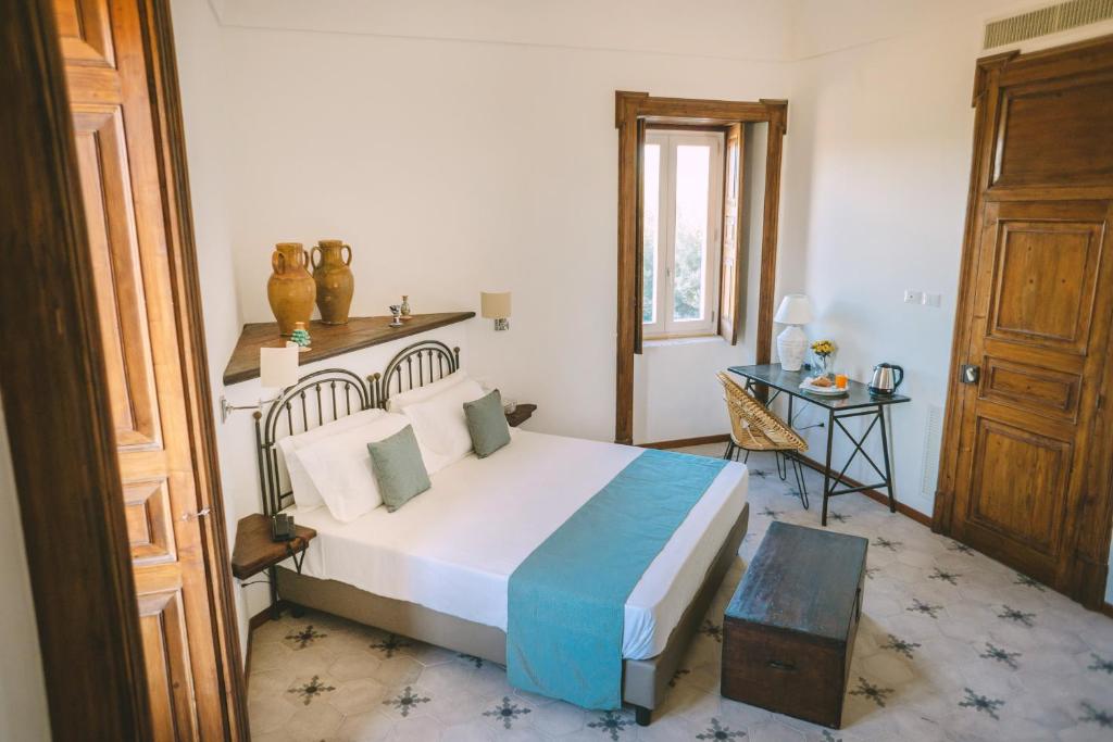 Postel nebo postele na pokoji v ubytování Masseria Testaferrata