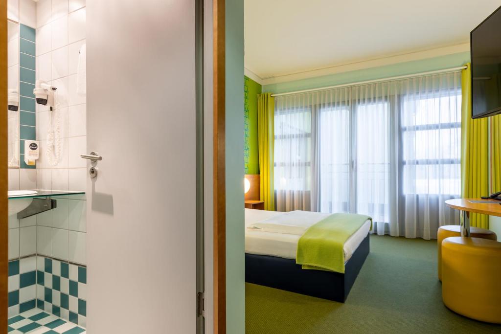 Postel nebo postele na pokoji v ubytování Hotel Fränkische Schweiz-Pegnitz