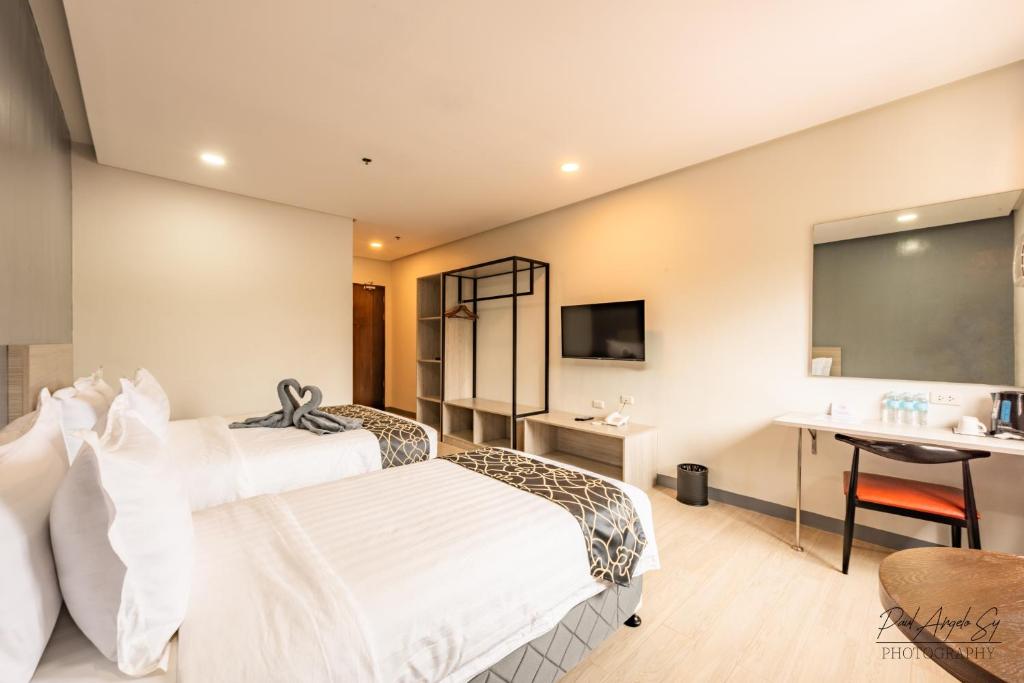 Postel nebo postele na pokoji v ubytování Hotel One