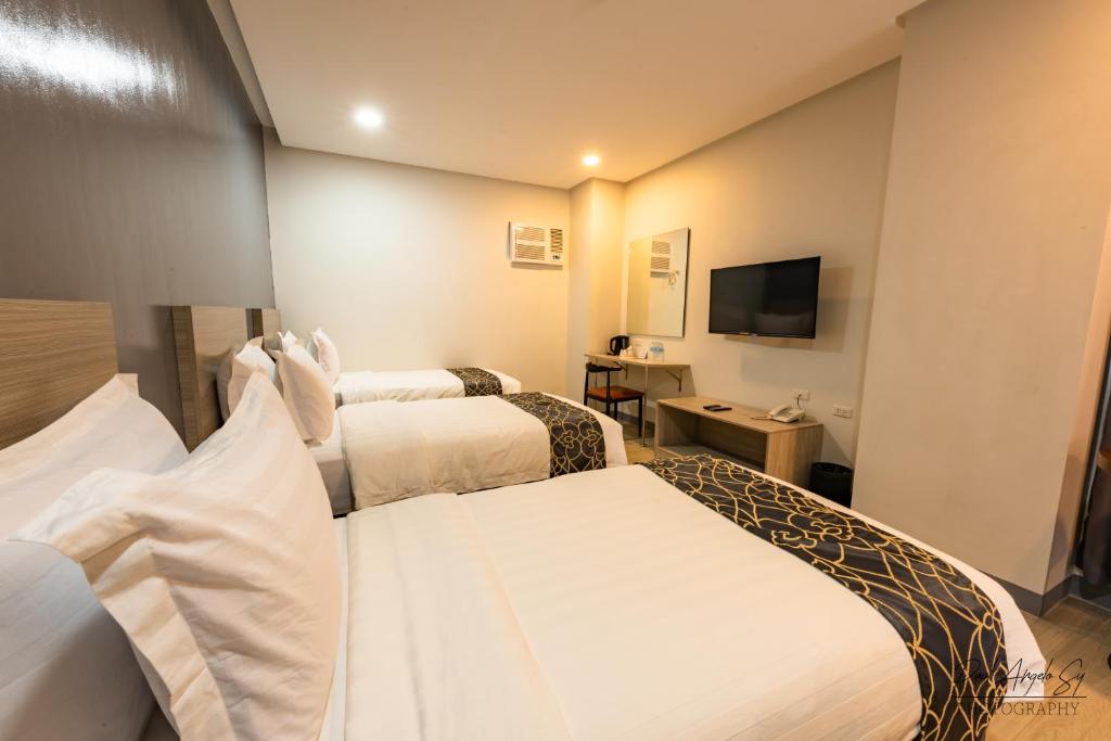 TV a/nebo společenská místnost v ubytování Hotel One