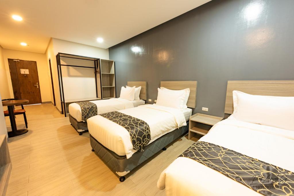Postel nebo postele na pokoji v ubytování Hotel One
