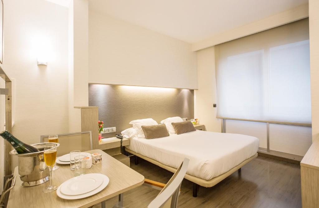 Postel nebo postele na pokoji v ubytování Aparthotel Silver