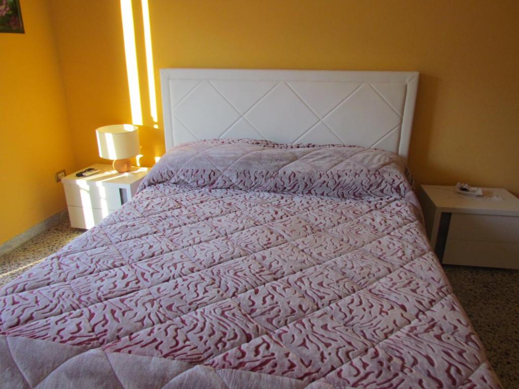 Łóżko lub łóżka w pokoju w obiekcie Casa di Chiara