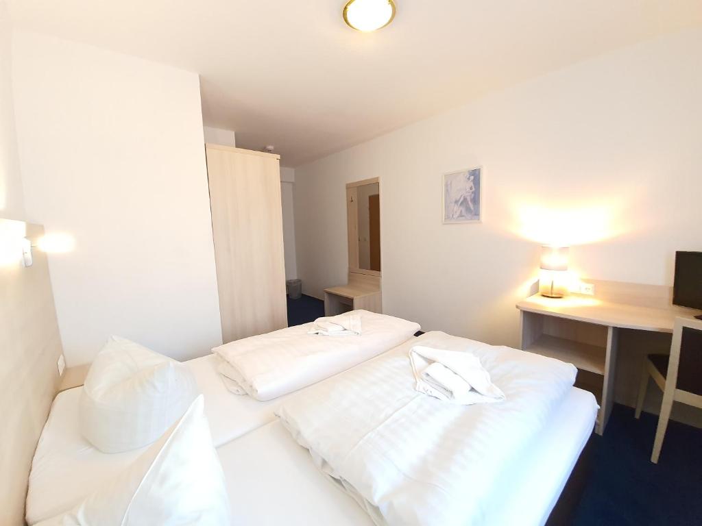 Postel nebo postele na pokoji v ubytování Apart Hotel Ferdinand Berlin