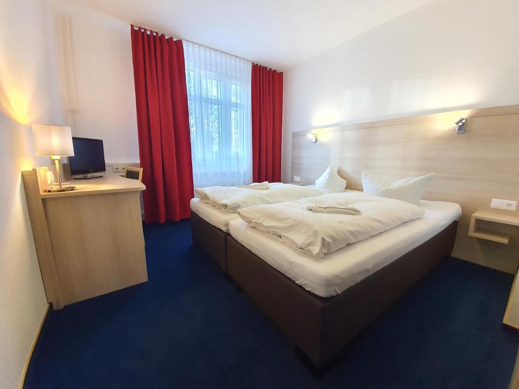 Postel nebo postele na pokoji v ubytování Apart Hotel Ferdinand Berlin