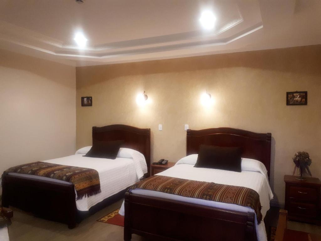 Postel nebo postele na pokoji v ubytování Hotel Casa Montero
