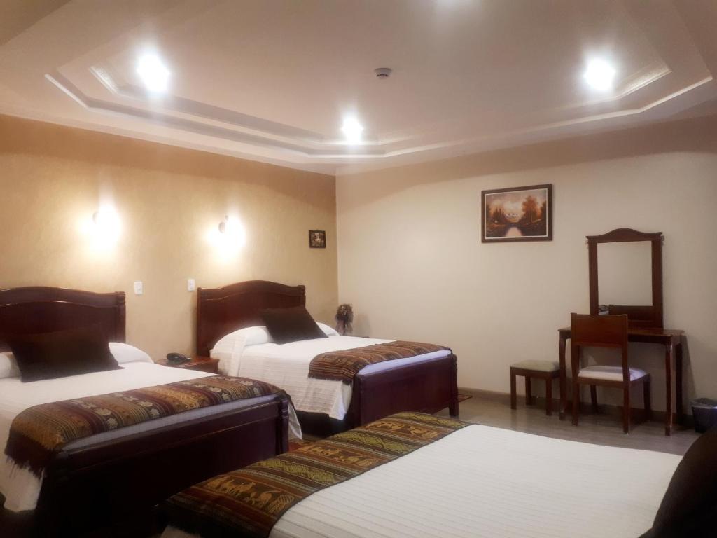 Postel nebo postele na pokoji v ubytování Hotel Casa Montero
