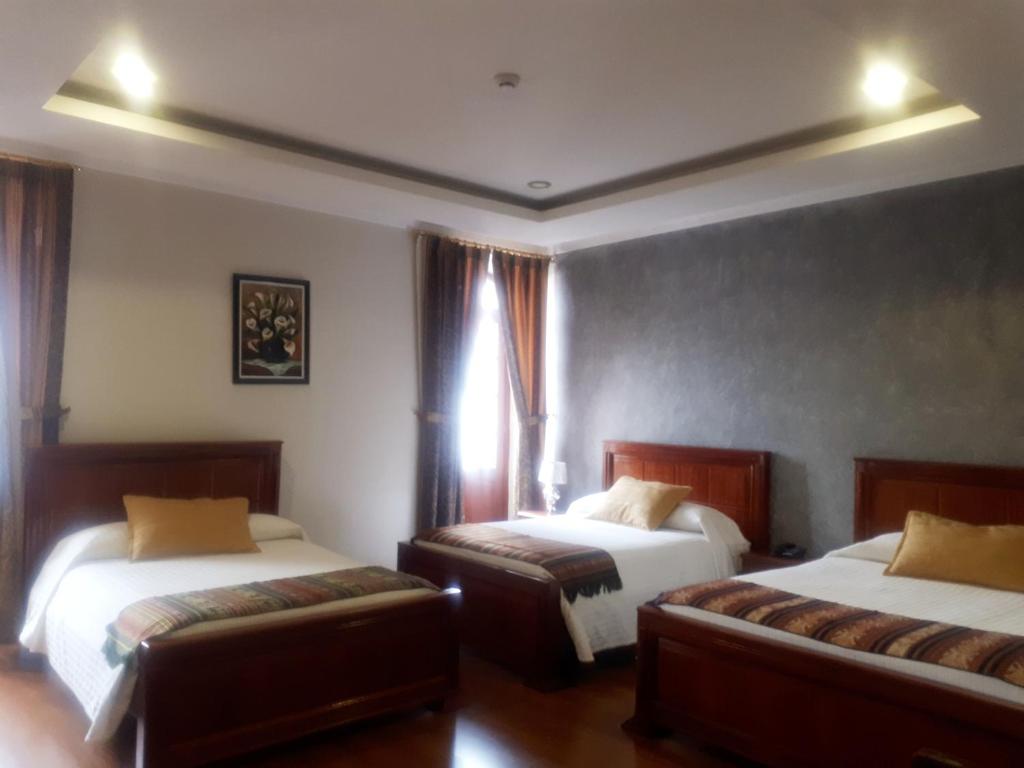 Postel nebo postele na pokoji v ubytování Hotel Casa Montero