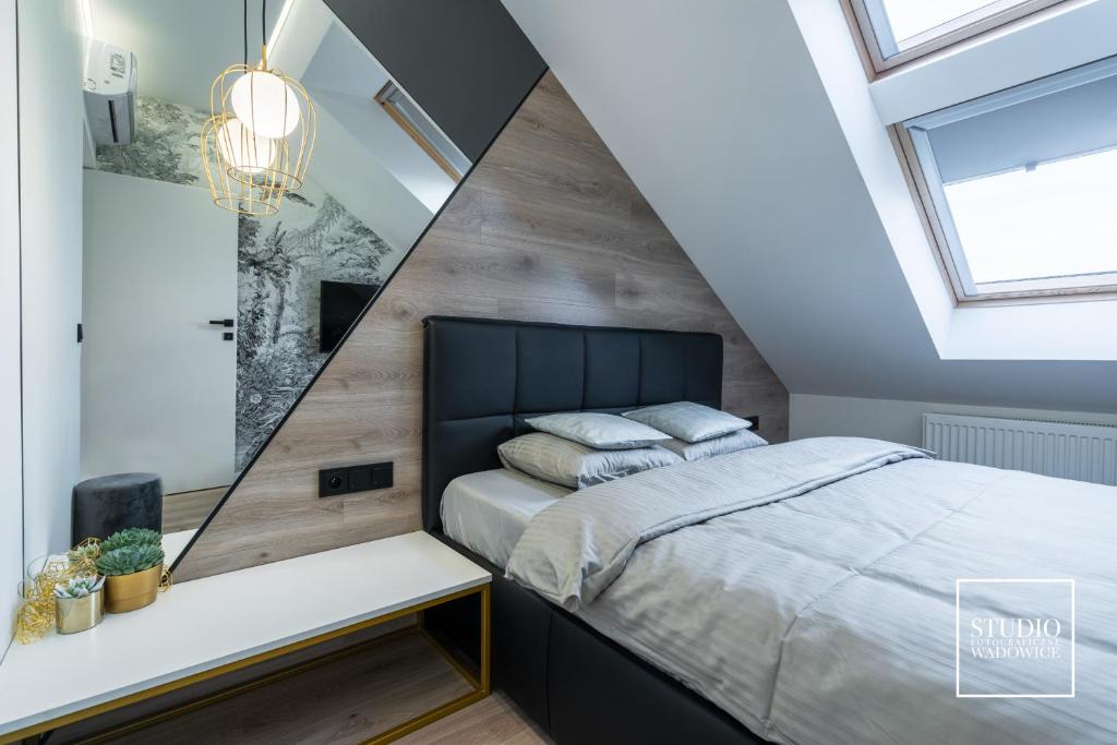 Posteľ alebo postele v izbe v ubytovaní Apartamenty Premium New