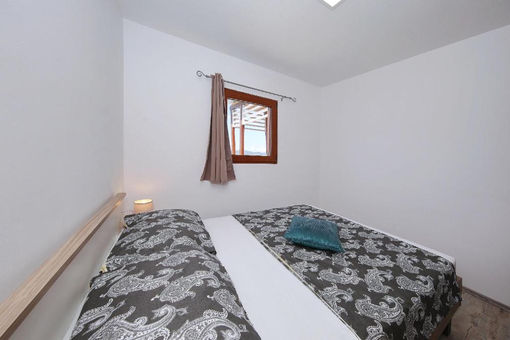 Posteľ alebo postele v izbe v ubytovaní Mobile home Plumeria 3
