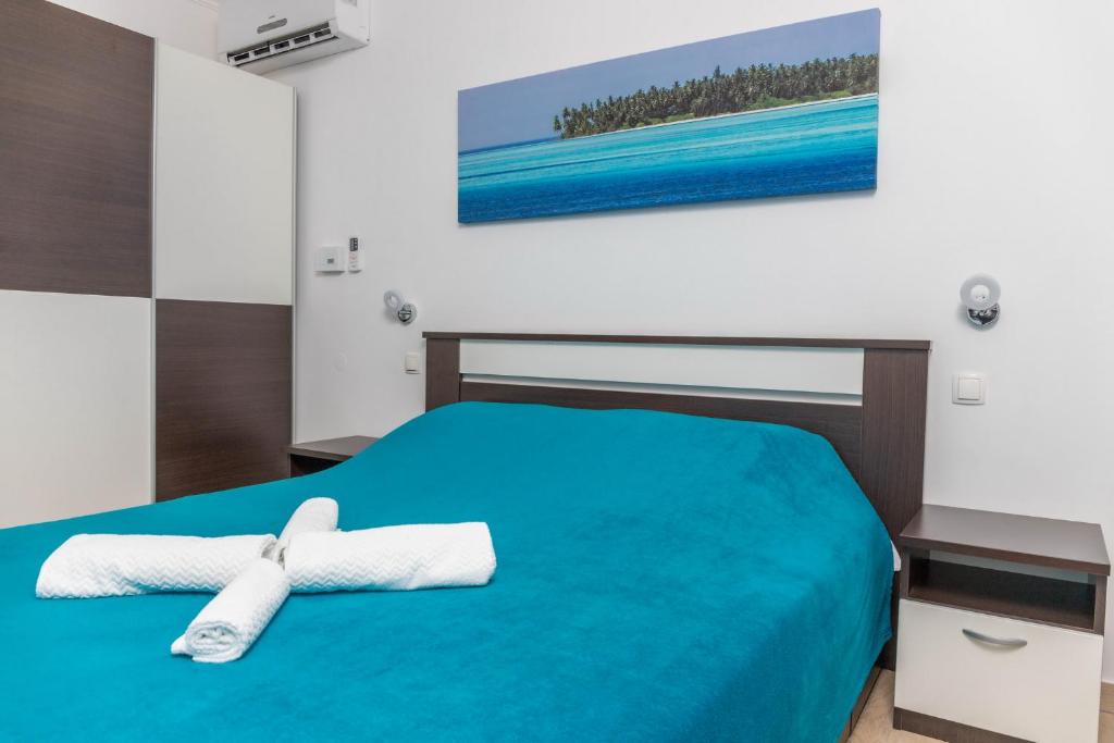 Postel nebo postele na pokoji v ubytování Guest House Sidro