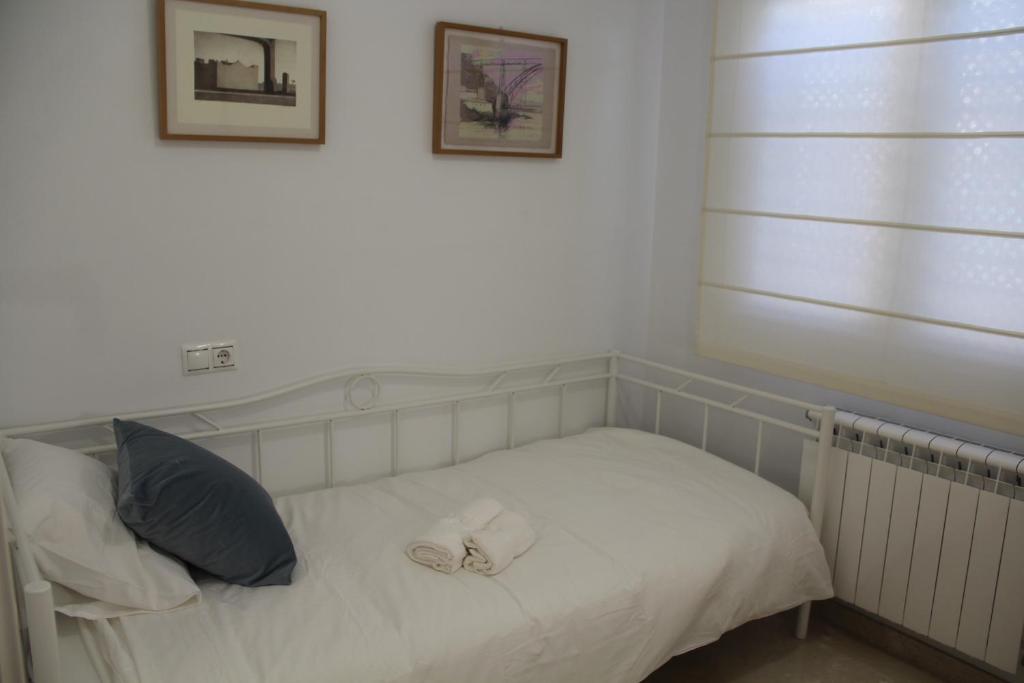 Posteľ alebo postele v izbe v ubytovaní Apartamento Iris