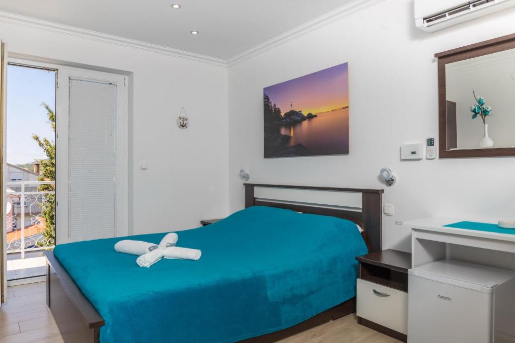 Postel nebo postele na pokoji v ubytování Guest House Sidro