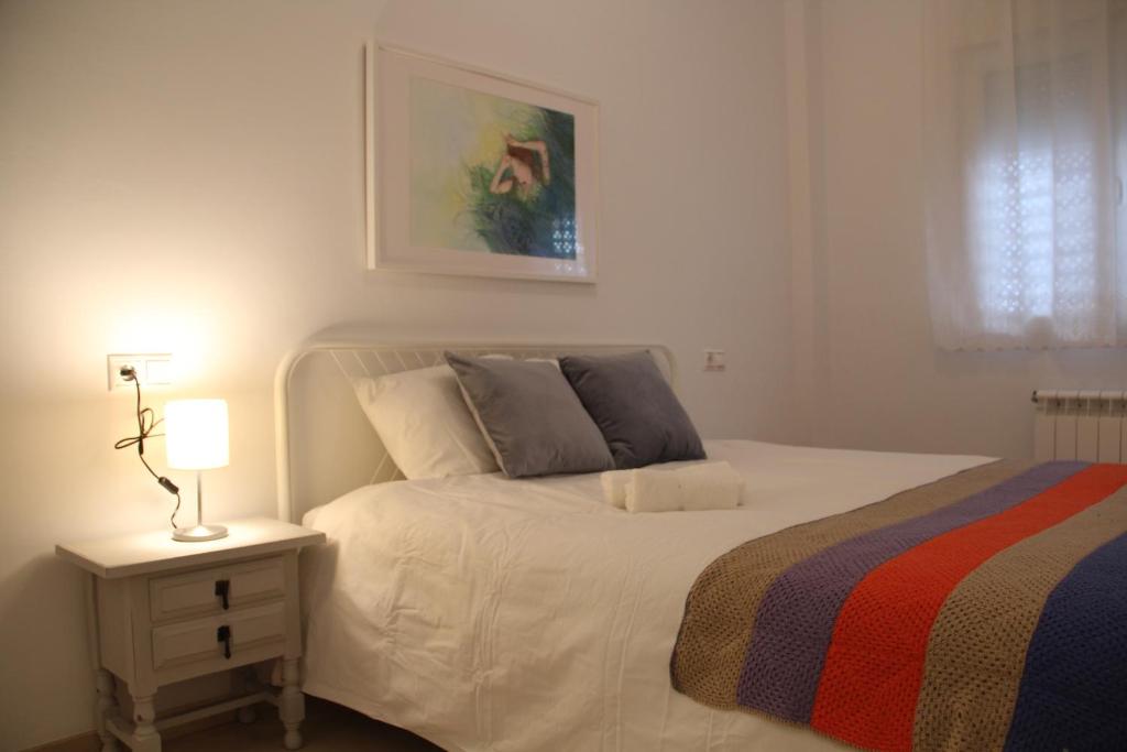 Posteľ alebo postele v izbe v ubytovaní Apartamento Iris