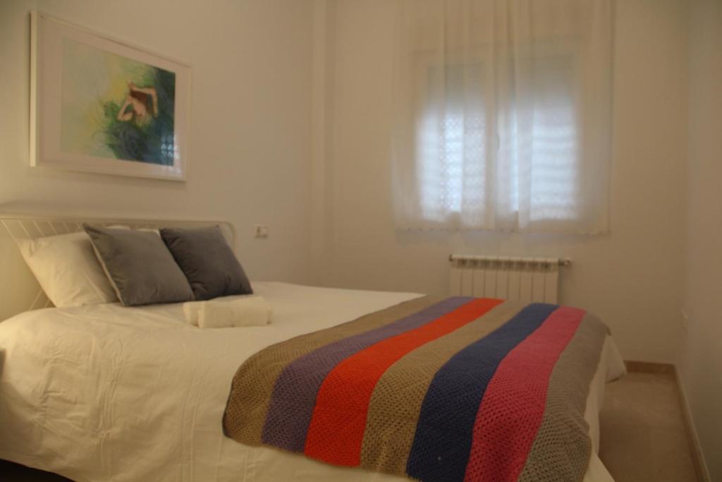 Posteľ alebo postele v izbe v ubytovaní Apartamento Iris