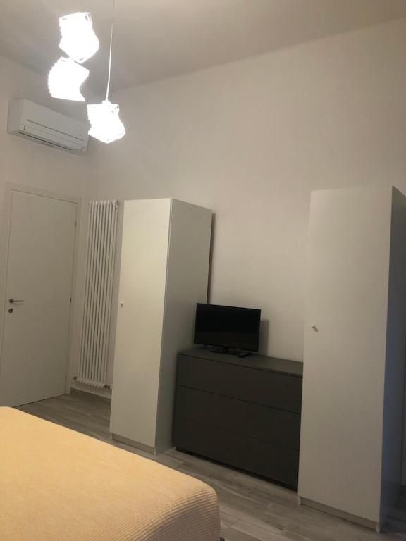 Łóżko lub łóżka w pokoju w obiekcie Casa Vincenzina