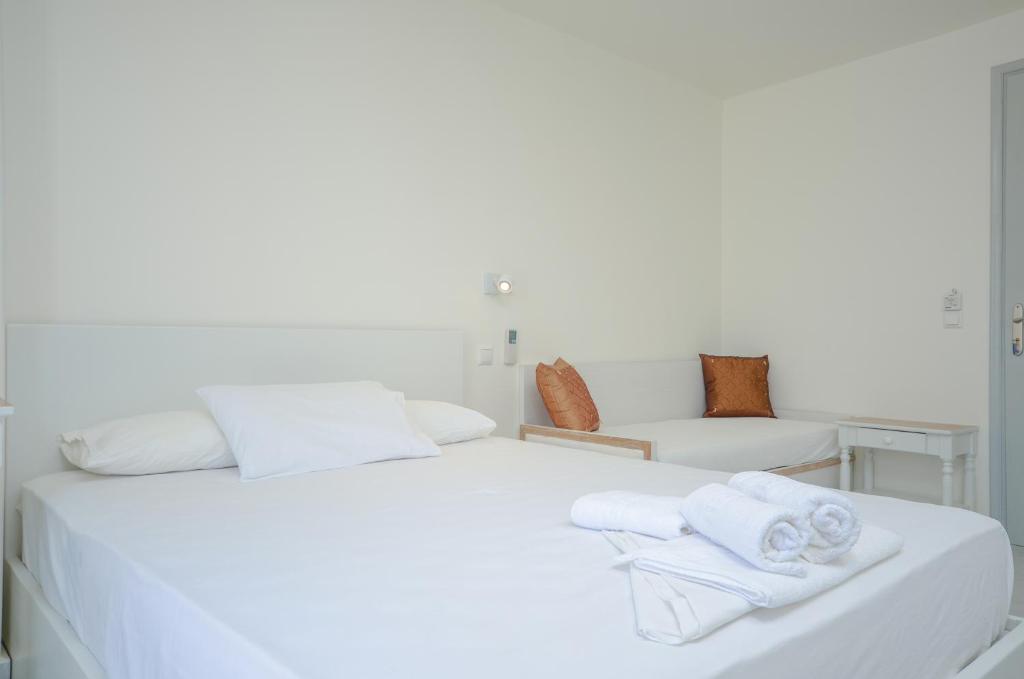 A bed or beds in a room at Soula Naxos