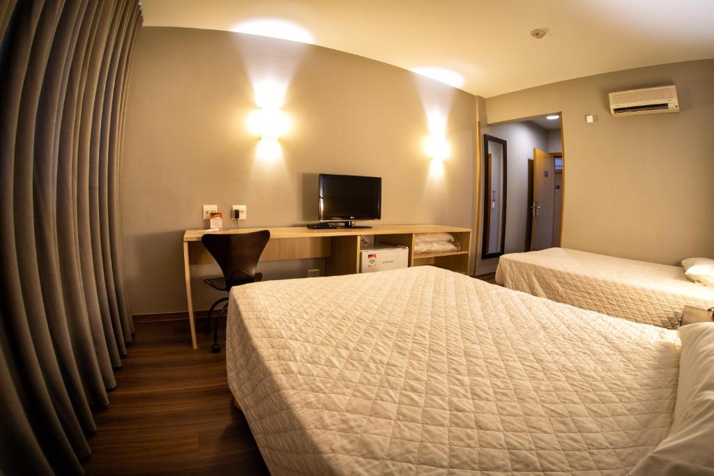 Postel nebo postele na pokoji v ubytování Hotel Campo Largo Express