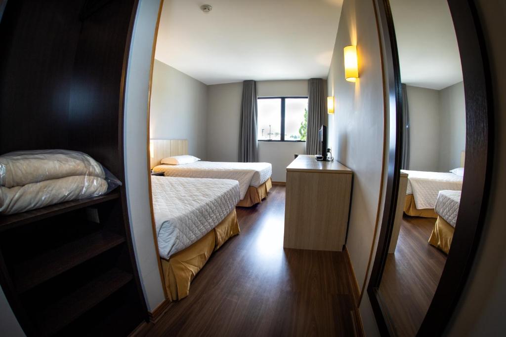 Postel nebo postele na pokoji v ubytování Hotel Campo Largo Express