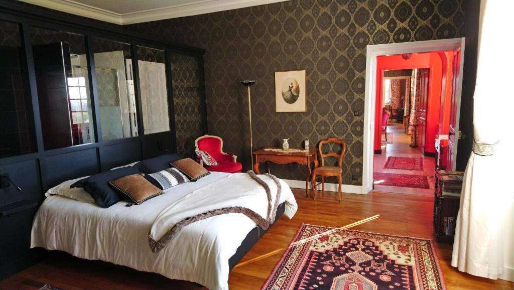 Postel nebo postele na pokoji v ubytování Manoir de Conjon