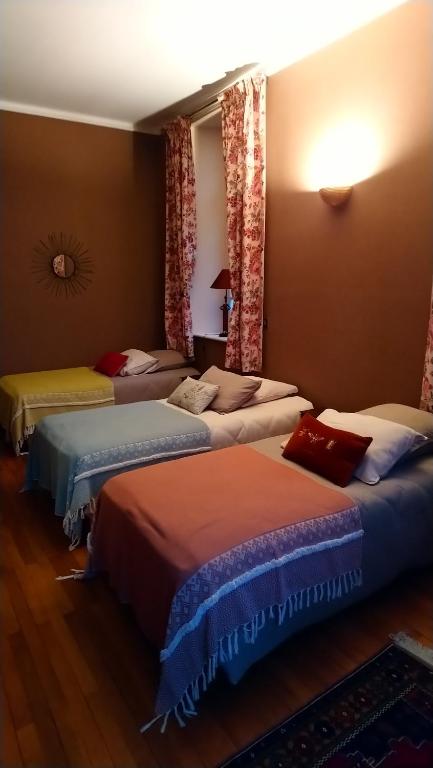 Postel nebo postele na pokoji v ubytování Manoir de Conjon