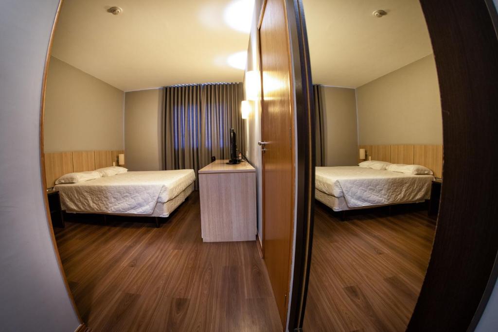 Postel nebo postele na pokoji v ubytování Hotel Campo Largo Express