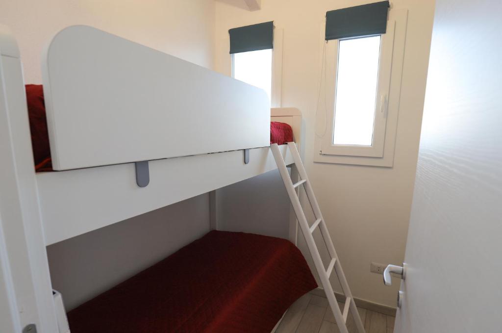 A bed or beds in a room at Barbara's house - Sardinia