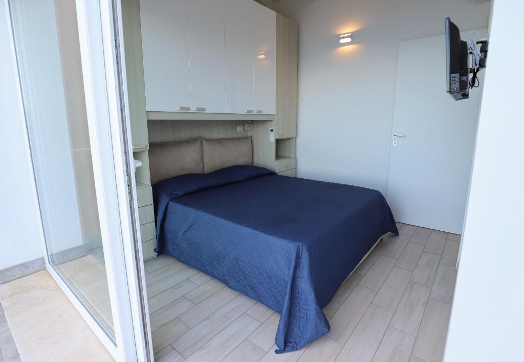 A bed or beds in a room at Barbara's house - Sardinia