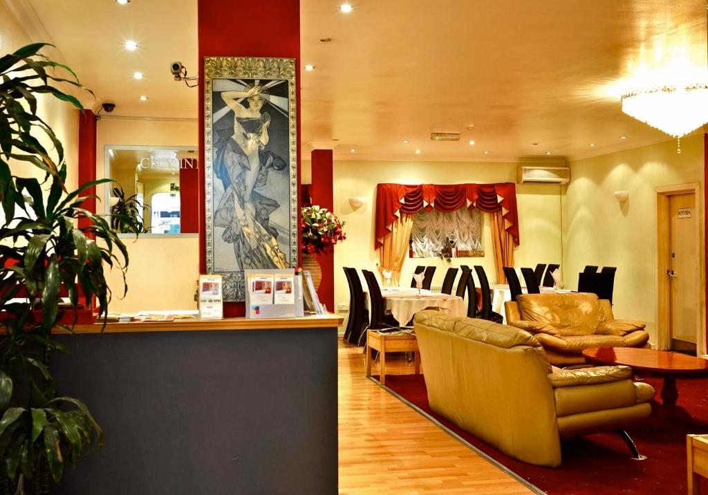 a lobby with couches and chairs in a store at City View Hotel in London