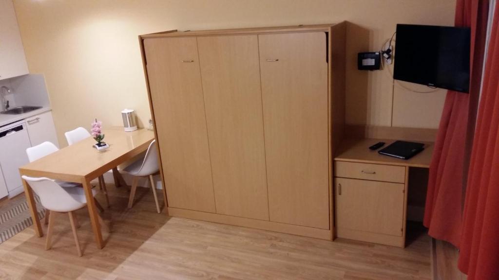 TV a/nebo společenská místnost v ubytování Herzerl Apartment