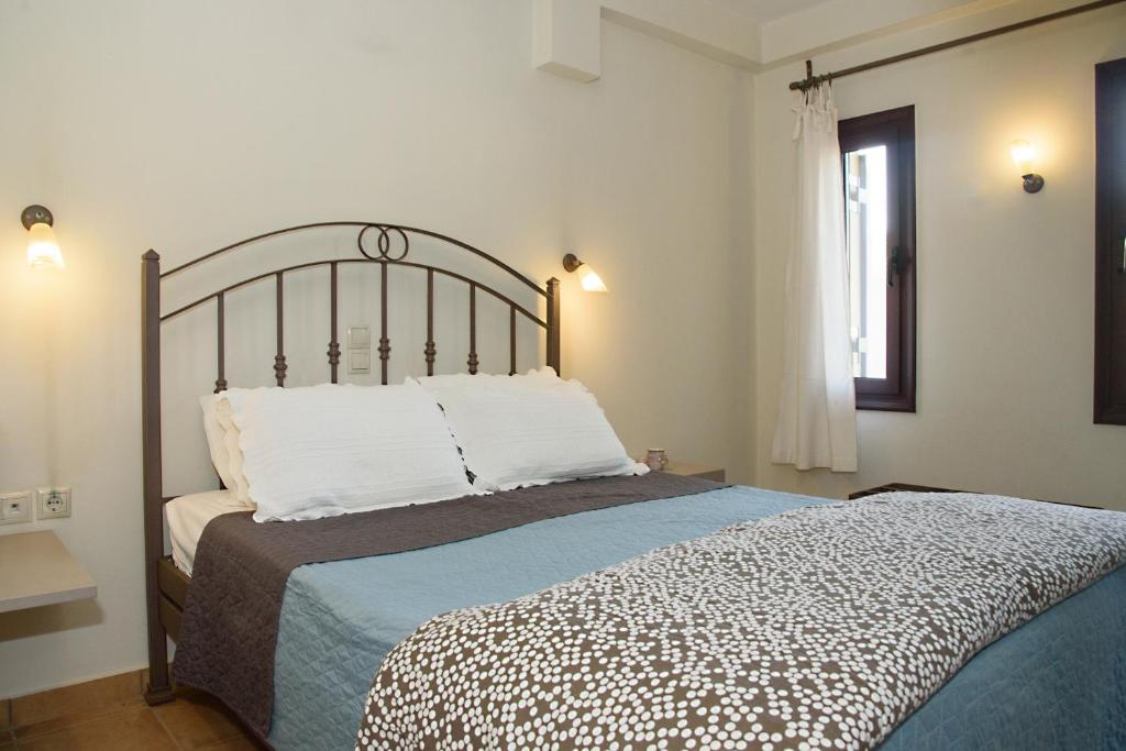 Postel nebo postele na pokoji v ubytování Cosis Inn