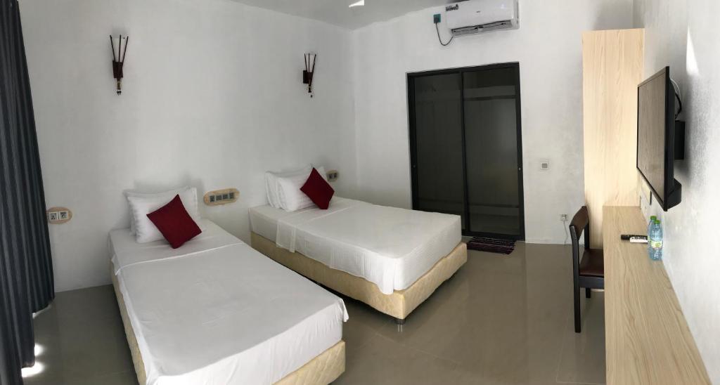 Postel nebo postele na pokoji v ubytování Royal Stay Inn