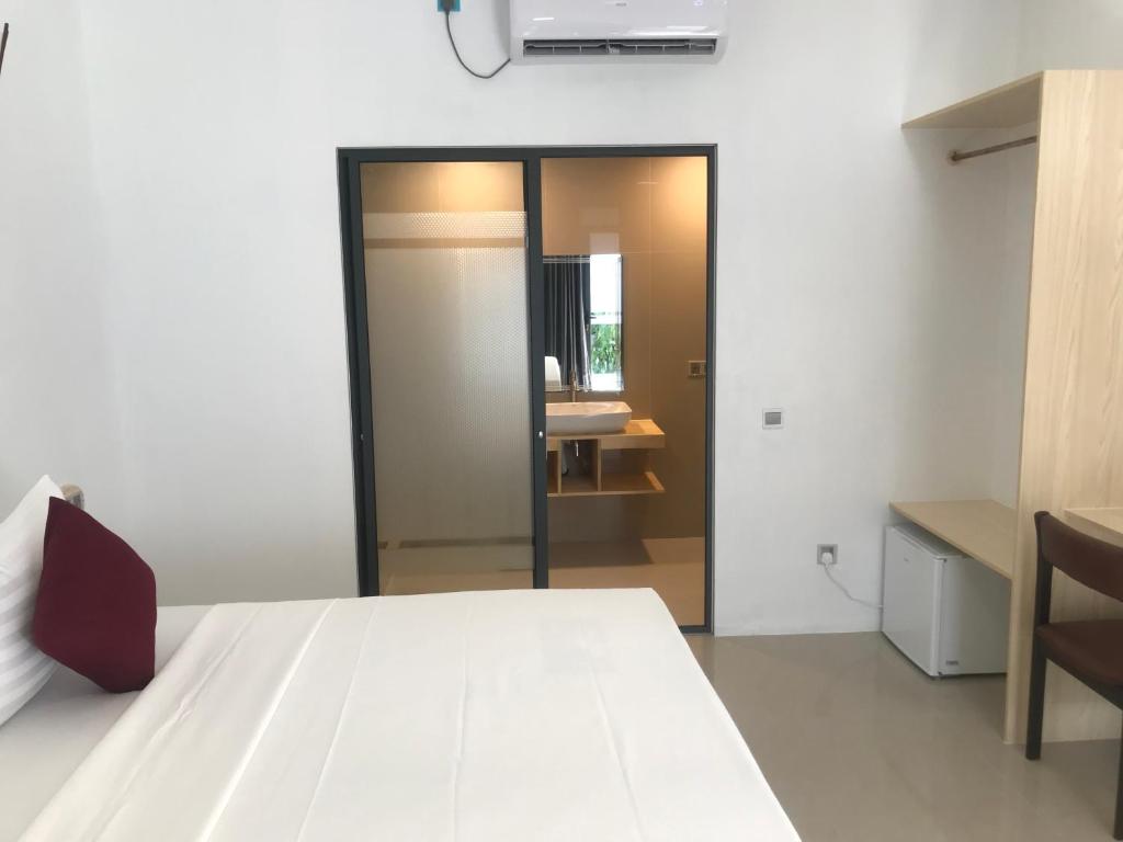 Postel nebo postele na pokoji v ubytování Royal Stay Inn