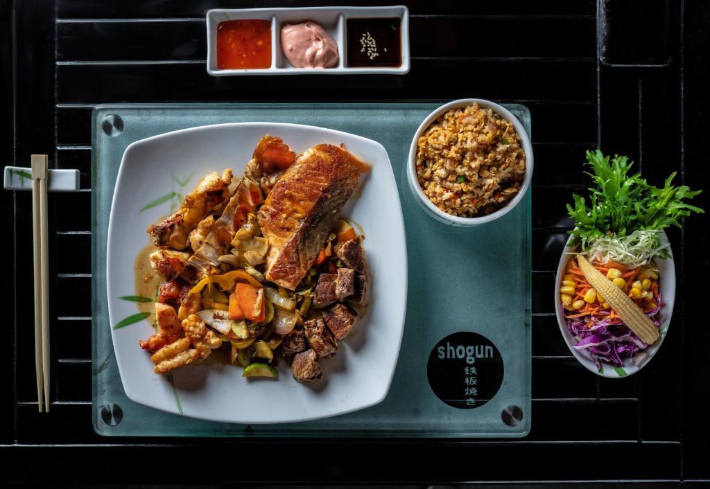 a tray with a plate of food on a table at Intercontinental Cairo Citystars by IHG in Cairo
