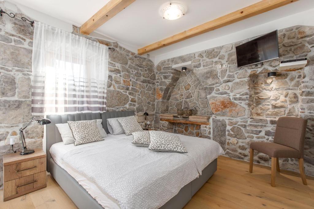 Postel nebo postele na pokoji v ubytování VILLA LAURA
