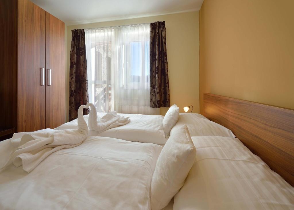 Postel nebo postele na pokoji v ubytování Villa Gloria Rooms & Apartments