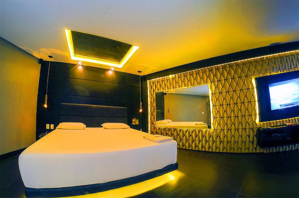 Postel nebo postele na pokoji v ubytování Nexos Motel Tamarineira (Adult Only)