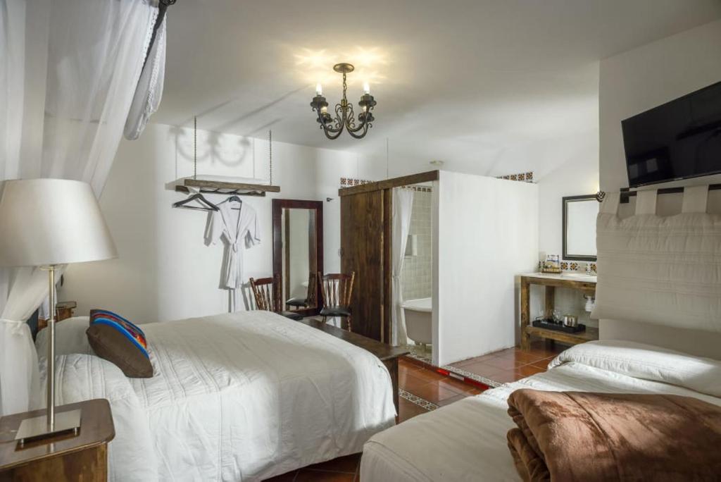 Postel nebo postele na pokoji v ubytování Hotel Tapalpa de Mis Amores