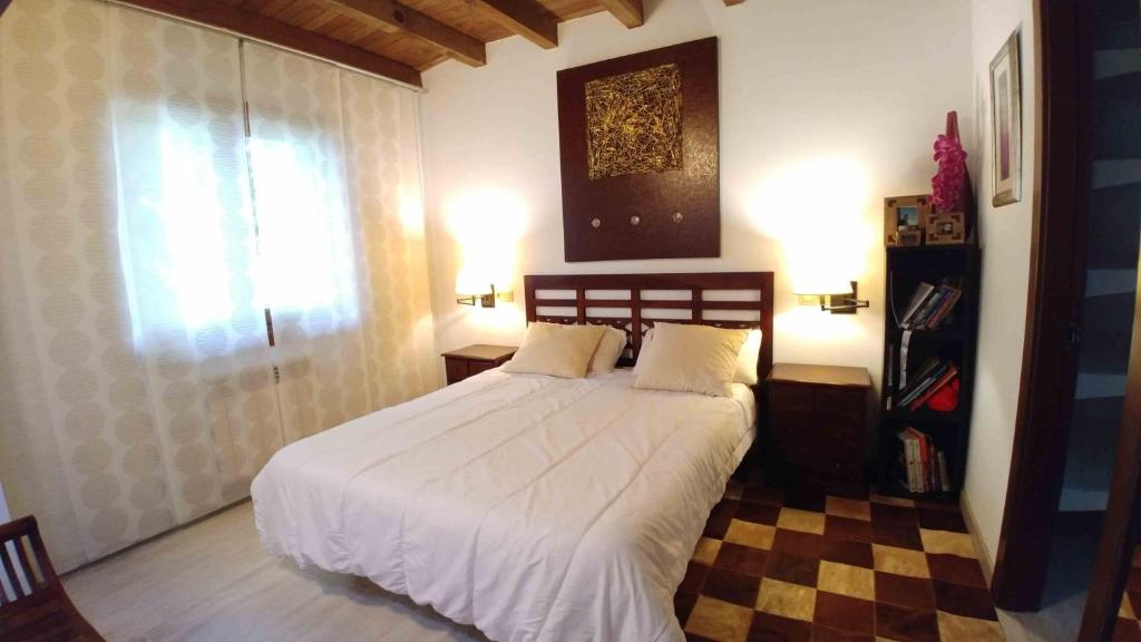 A bed or beds in a room at La Calma de Llanes