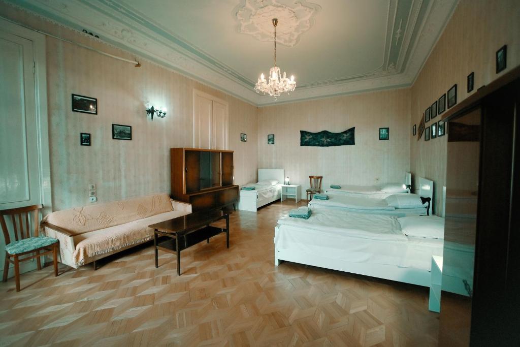 Postel nebo postele na pokoji v ubytování Guest House Old Kutaisi