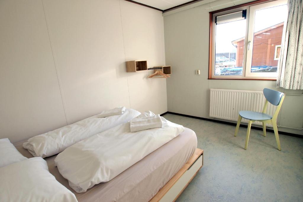 Postel nebo postele na pokoji v ubytování Amsterdam Farm Lodge