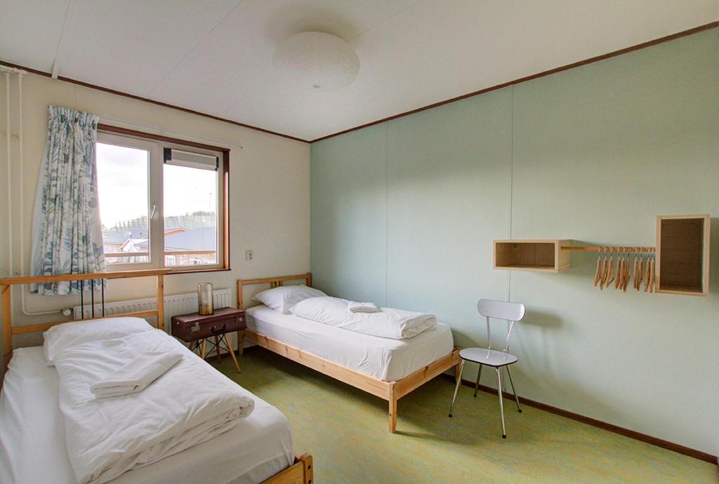 Postel nebo postele na pokoji v ubytování Amsterdam Farm Lodge