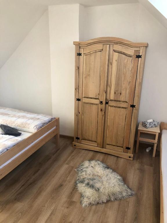 Postel nebo postele na pokoji v ubytování Apartmán U Kapličky