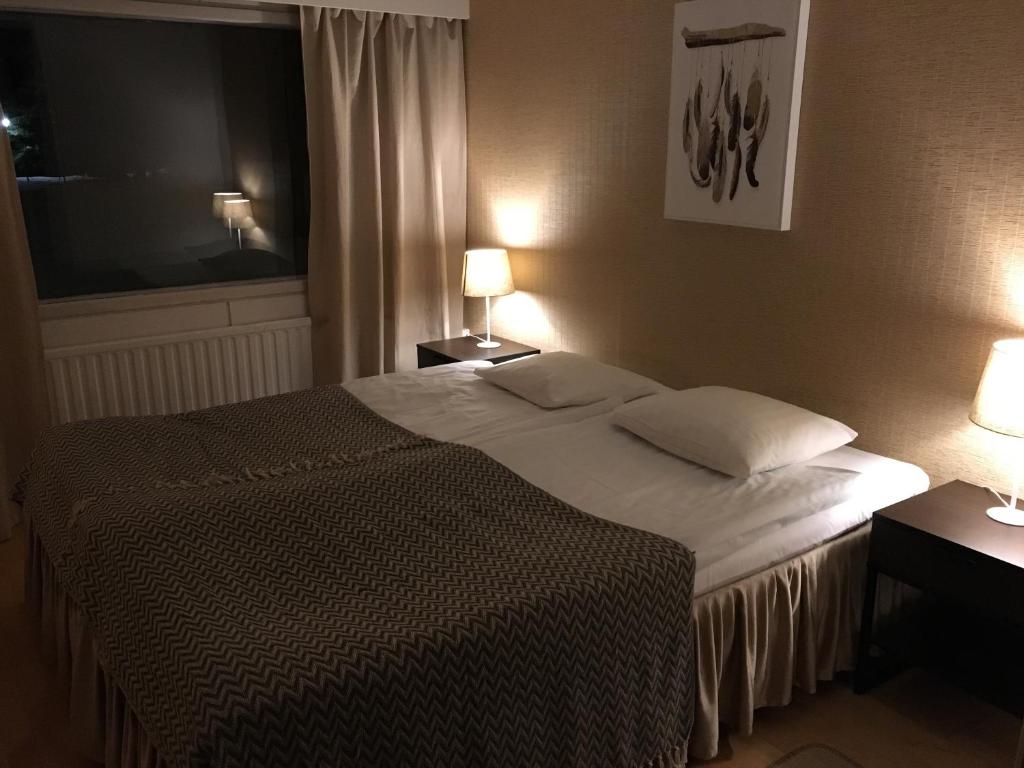 Postel nebo postele na pokoji v ubytování Hotel Yöpuu