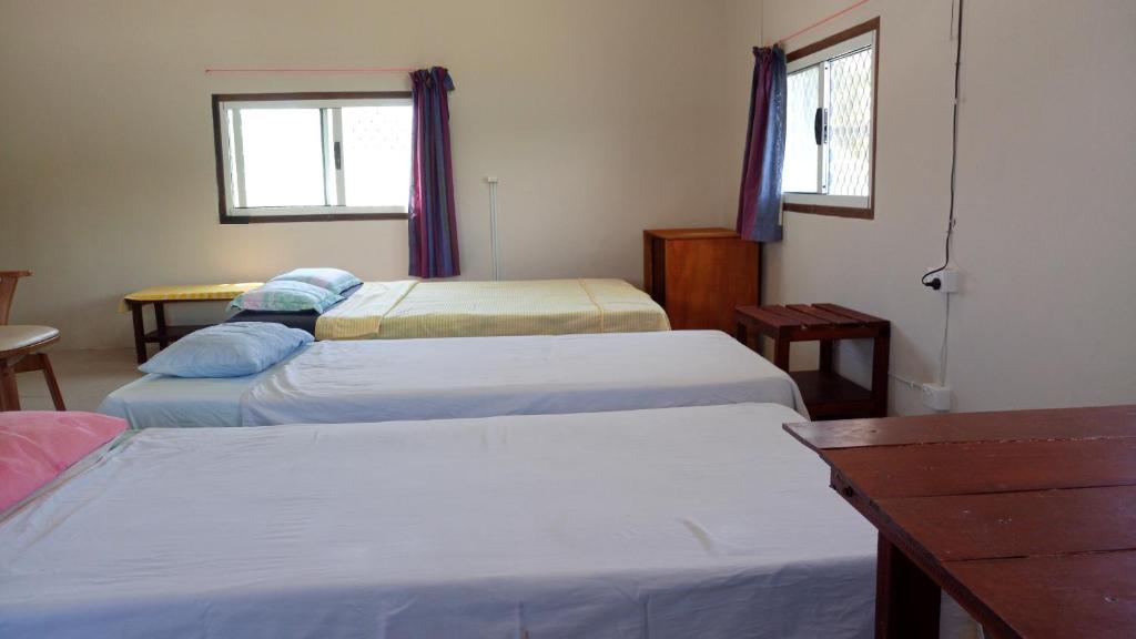 Postel nebo postele na pokoji v ubytování Bluepango Guest House