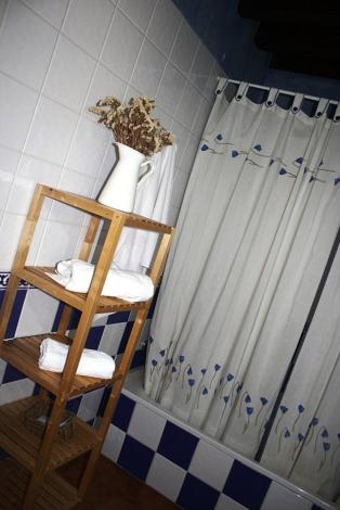 
a bathroom with a sink and a mirror at HOTEL RURAL SIERRA DE FRANCIA in Sotoserrano
