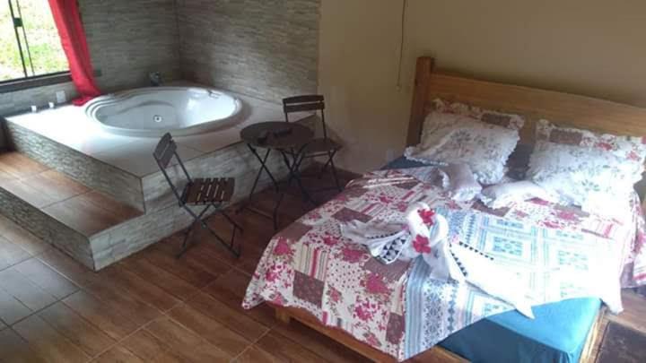 Postel nebo postele na pokoji v ubytování Pousada Leal Chalé